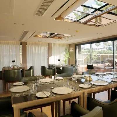 Dining room beneath its retractable skylight